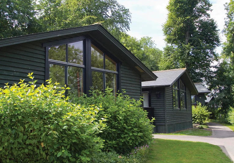 Exterior shot of the Woodland Lodges accommodation at Broome Park