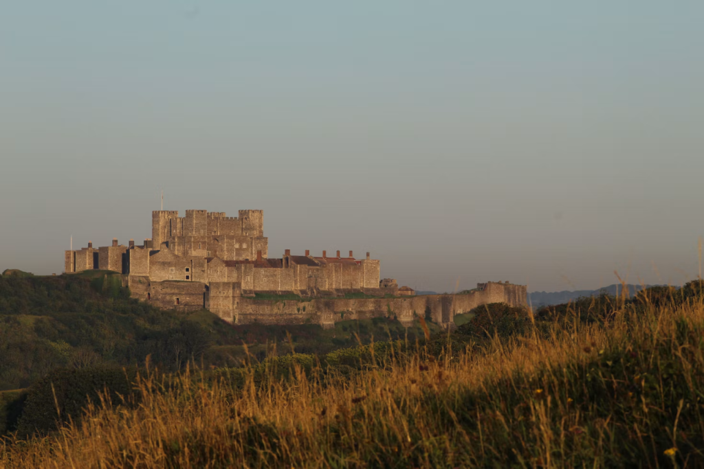 A zoomed out shot of Dover Castle on a foggy day